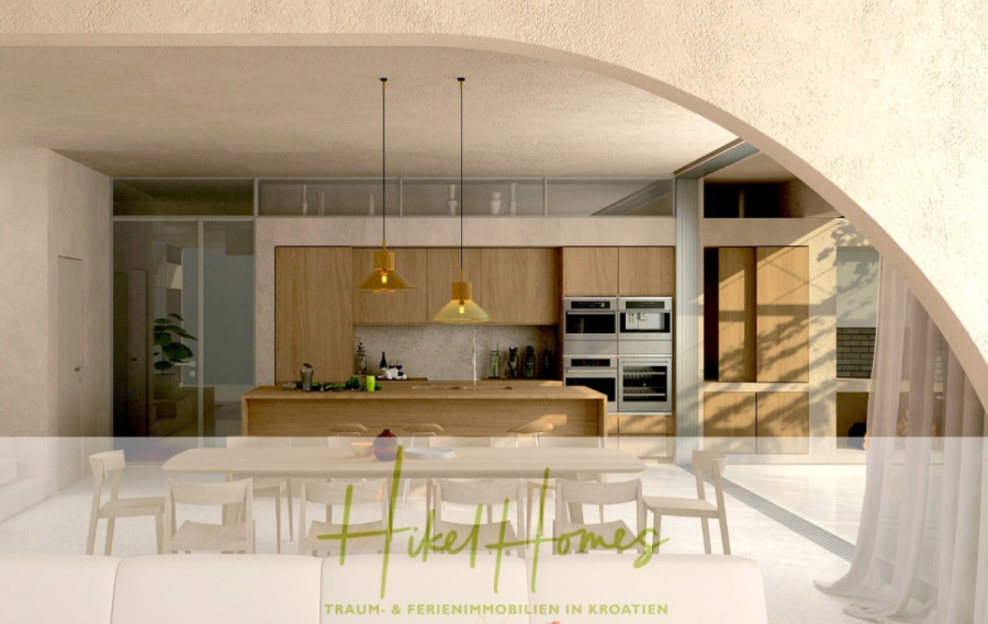 Prämiertes Architekturprojekt – Meerblick Luxus auf 490m² auf 1800m² Grund mit 2 Pools, Bar, Lounge - Moderne Küche und Essbereich mit Holzschränken, einer zentralen Insel, Pendelleuchten und einem langen Esstisch mit weißen Stühlen, gesehen durch eine große Bogenöffnung. Der Text "Hikel Homes" erscheint am unteren Rand. (45058)